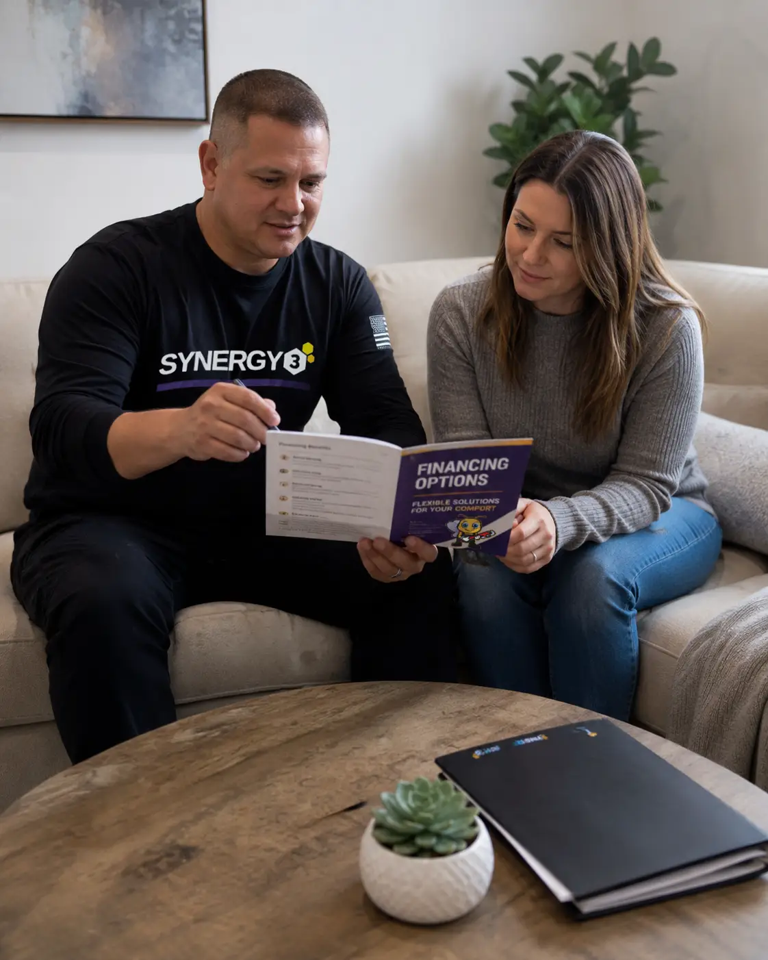 Synergy3 specialist reviewing financing options with a homeowner.